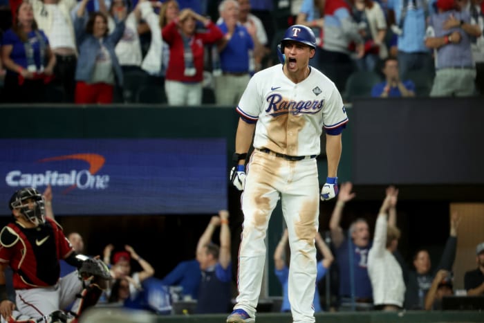 Oct 27, 2023; Arlington, TX, USA; Texas Rangers shortstop Corey Seager (5) hits a two-run home during the ninth inning in game one of the 2023 World Series against the Arizona Diamondbacks at Globe Life Field. Mandatory Credit: Kevin Jairaj-USA TODAY Sports